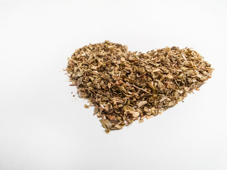 Heart shape oregano whole on white の写真素材