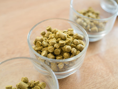 Hops pellets in glass cupl for brewing beer - Beer ingredient