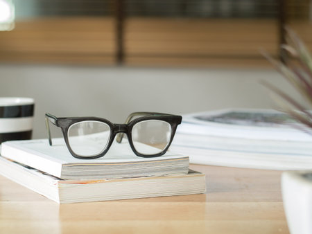Vintage eyeglasses on booksの写真素材