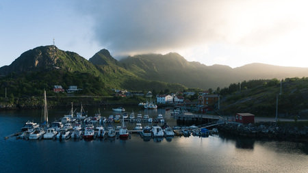 Beautiful landscape of picturesque harbor with fishing boat and traditional Norwegian rorbus in Stamsund, Lofoten islands, Norwayの写真素材