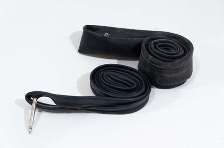 Old deflated Rubber Tire Tube for Bicycling with valveの写真素材