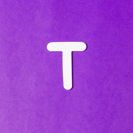 Uppercase letter T - wood texture - Purple backgroundの写真素材