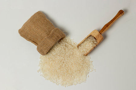 spilled rice grains - white backgroundの写真素材