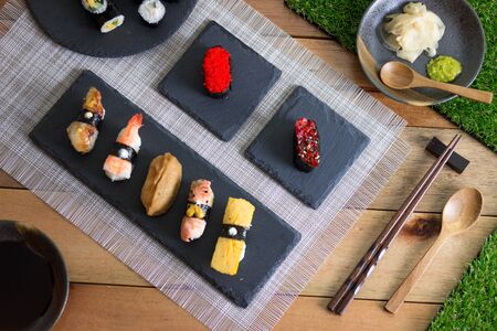 Sushi Variety on Wooden Tableの写真素材