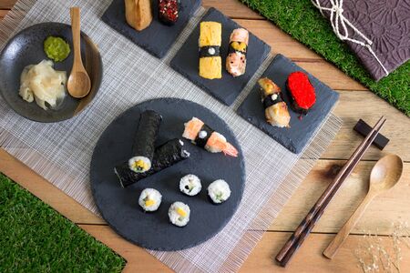 Sushi Meal on Wooden Table with bookの写真素材