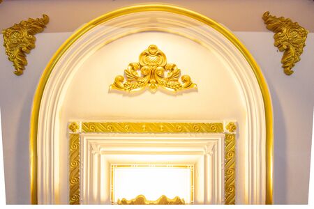 golden curve frame on a white backgroundの写真素材