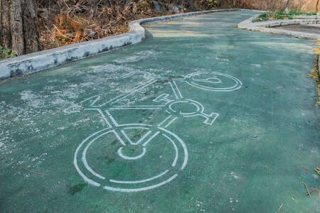 Old green bicycle path made of cementの写真素材