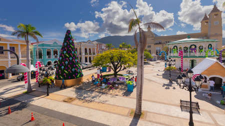 Workers putting up Christmas decorations in the Latin American town square of Puerto Plata, Dominican Republic on the island of Hispaniola.の写真素材