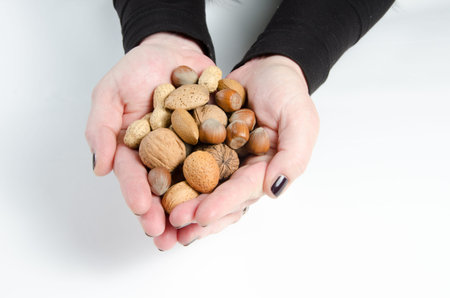 woman hand with nuts in her