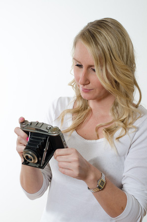 young woman with historic cameraの写真素材