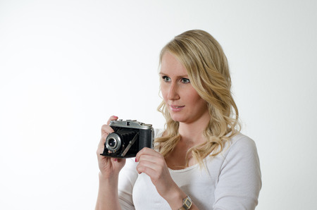 young woman with historic cameraの写真素材