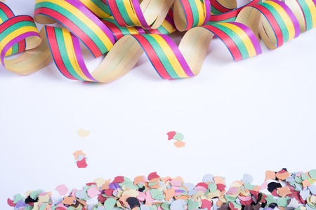 streamers and confetti for carnival on white backgtoundの写真素材