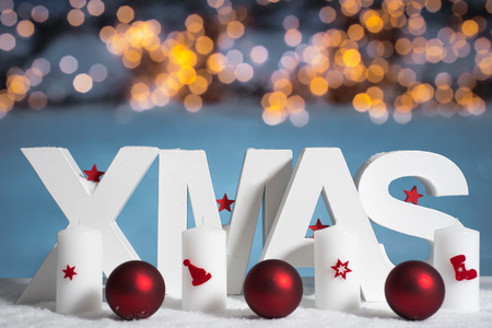 XMAS in white letter with blurred light backgroundの写真素材