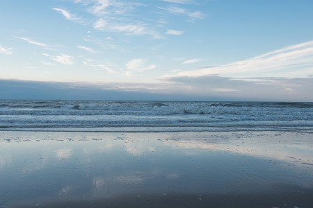 Beach and surf of the North Sea in Koksijde, Belgiumの写真素材