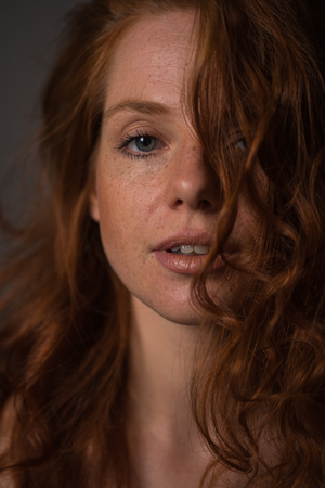 sensual portrait of a redheaded beautiful womanの写真素材