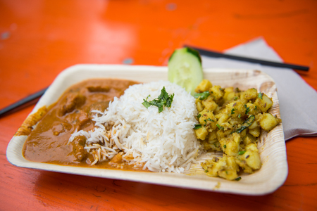 Street Food - Curry with rice and potatoes in a bowlの写真素材