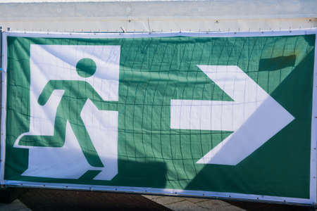 Transparent as a sign for the escape route at an event.の写真素材