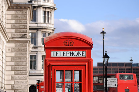 Red telephone box and double decker bus in Londonの写真素材