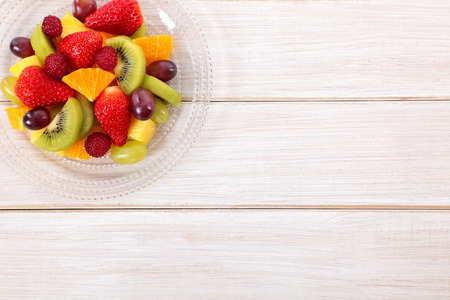 Fruit salad mixed fresh fruits with copyspace. Top view.の写真素材