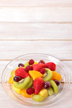Fruit salad mixed fresh fruits with copyspaceの写真素材