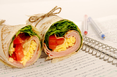School lunch of ham and cheese wrap sandwichの写真素材