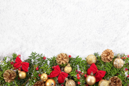 Christmas border with decorations on the snow. Space for copy.の写真素材