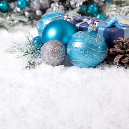 Christmas border with decoration and baubles on the snow squareの写真素材