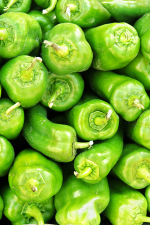 Pile of green peppers at local market in southern Spainの写真素材