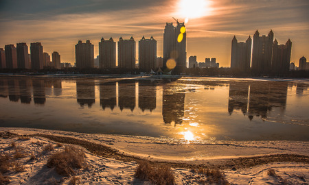 View of urban city in winter at sunsetのeditorial素材