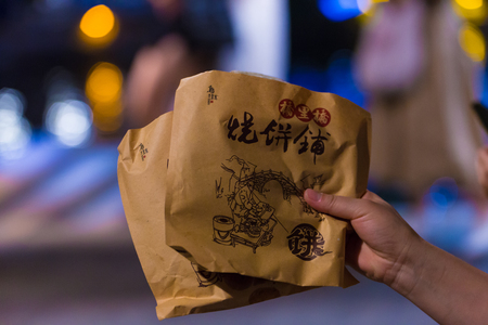 Person holding food packagingsのeditorial素材