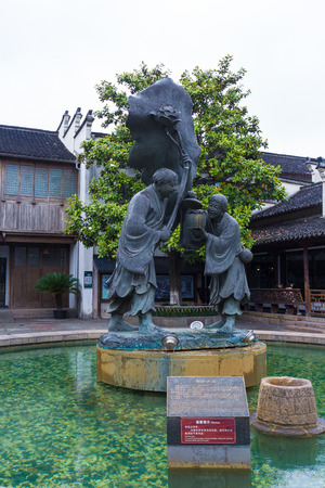 View of a fountain with statue in Wuzhen, Zhejiang, Chinaのeditorial素材