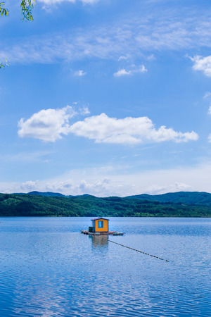 Orange hut floating on the waterのeditorial素材