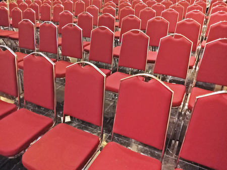 Row of red chair in meeting room as backgroundの写真素材