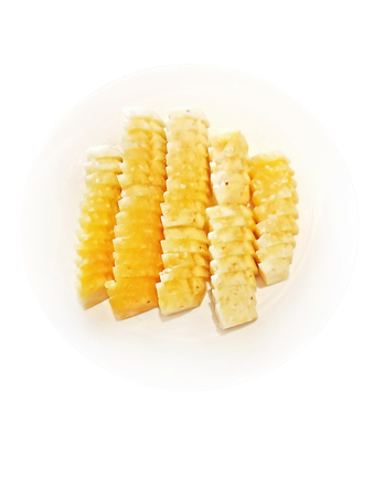 Top view, Isolated Sliced pineapple on white plateの写真素材