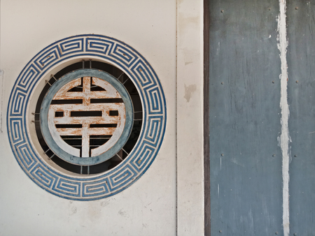 Old Chinese window and door in shrine for backgroundの写真素材