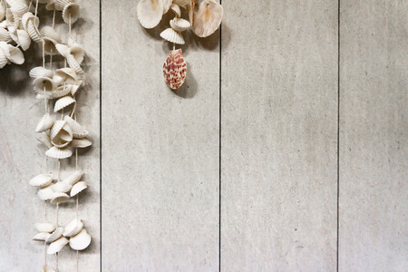 Hanging many shell on wall with space for backgroundの写真素材