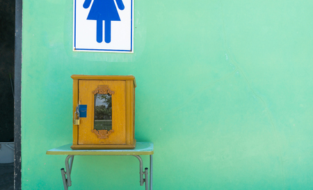 Wooden Donate box at front of toilet roomの写真素材