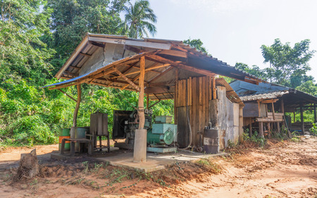 Old power generator in open room on islandの写真素材