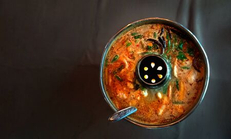Tom-yum-kung ; Thai spicy shrimp soup in hotpot Top viewの写真素材