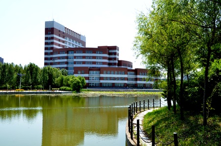 View of a building by the park with a lakeのeditorial素材