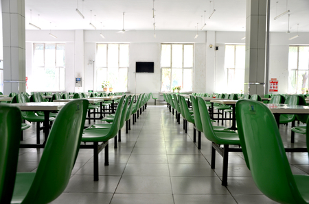 Empty tables and chairs in a cafeteriaのeditorial素材
