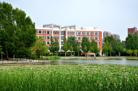 Exterior view of an architectural building by a lotus lakeのeditorial素材