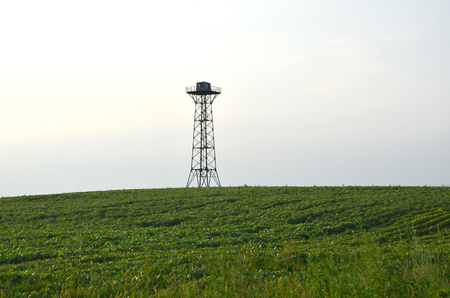 Metal tower in a fieldの写真素材