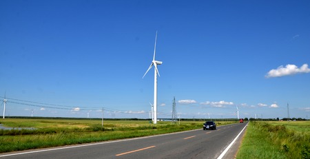 Wind turbines beside a highwayのeditorial素材