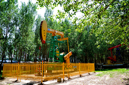 Oil derrick pumps in an areaのeditorial素材