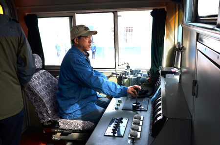 Train engineer in a train cockpit