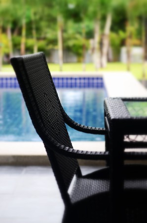 Chair along a swimming pool の写真素材