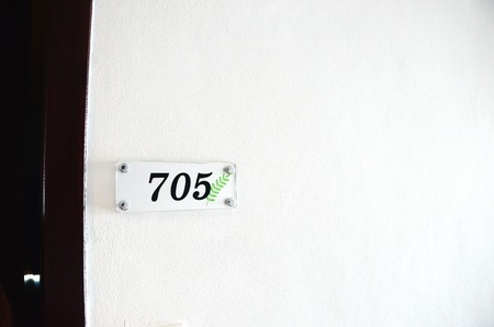 Picture of a hotel room number plateの写真素材