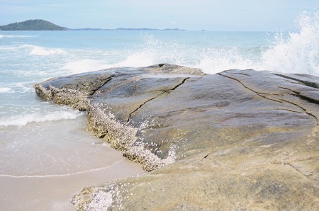 Waves crashing onto rocks in the seaの写真素材