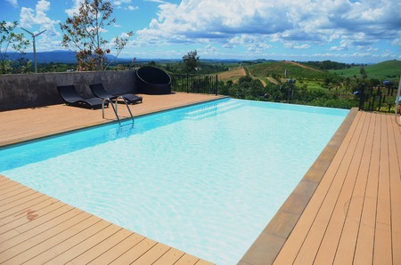 Swimming pool with stair at hotel close upの写真素材